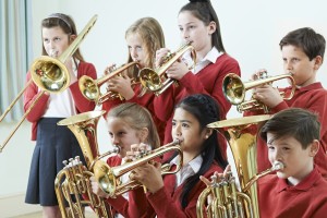 Group Of Students Playing In School Band Together